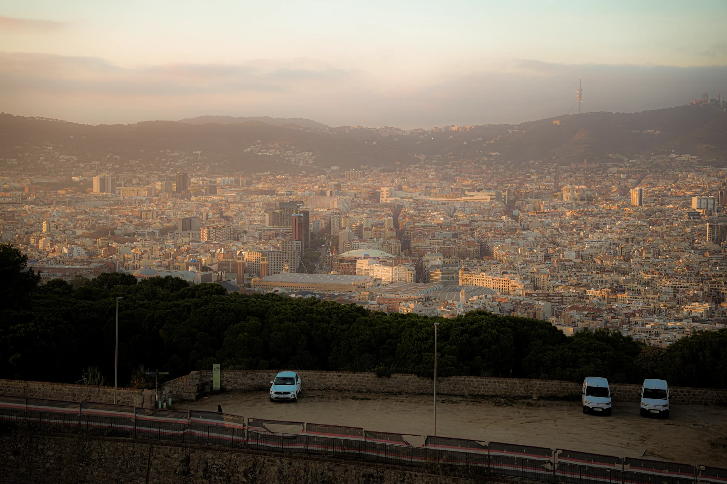 Barcelona’s skyline and surrounding hills in warm sunset light